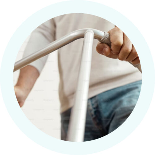 Person holding a walking frame