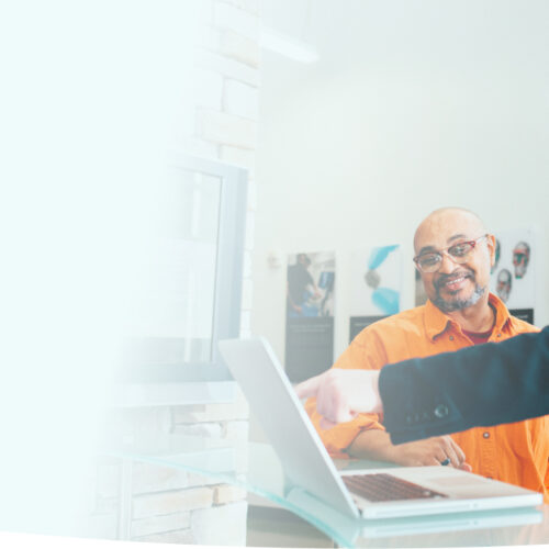 Person pointing to the laptop screen